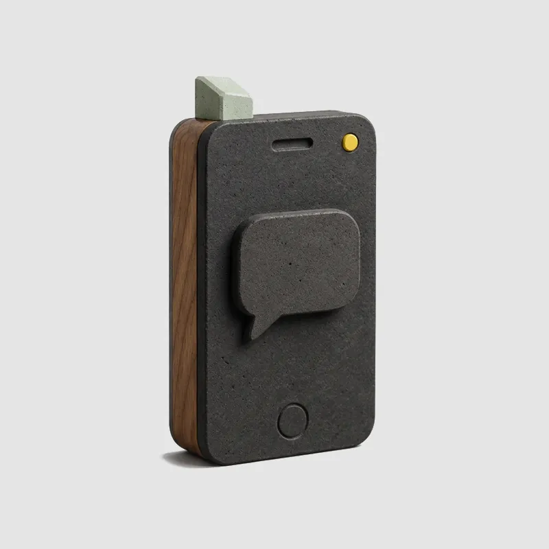 Sculpted matte-black phone block with an SMS speech bubble, a mint accent and a small yellow dot